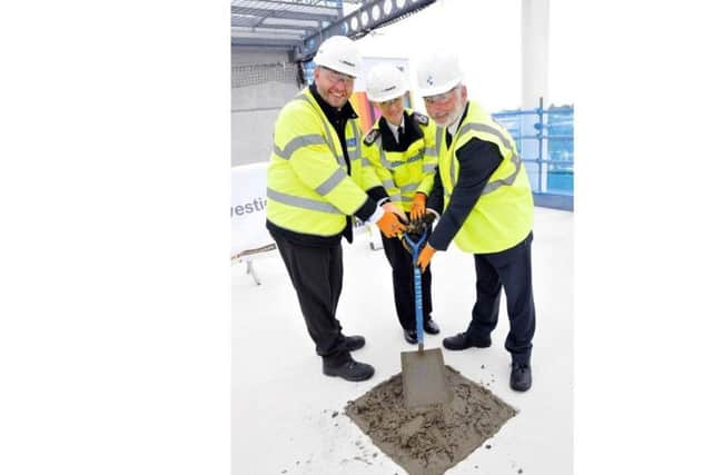 A topping out ceremony was held for the new police investigation centre in Portsmouth. (L to R) James Payne, Police and Crime Commissioner's chief executive, Chief Constable Olivia Pinkney and PCC Michael Lane.