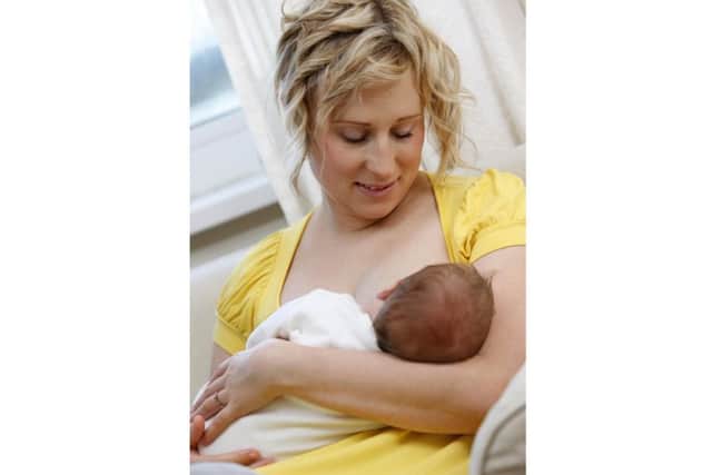 A mother breastfeeding her new born baby. PA Photo/JupiterImages Corporation.