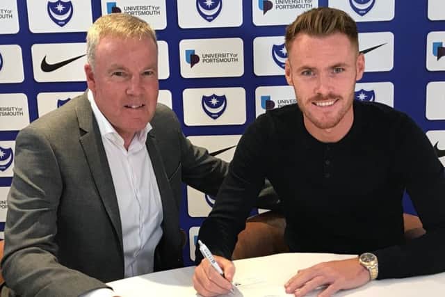 Kenny Jackett welcomes Tom Naylor to Fratton Park Picture: Portsmouth FC