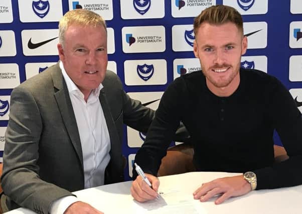 Kenny Jackett welcomes Tom Naylor to Fratton Park Picture: Portsmouth FC