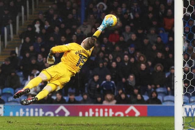 Craig MacGillivray pulls off a stunning stop for Shrewsbury at Fratton Park last season. Picture: Joe Pepler