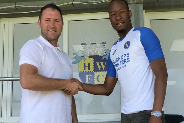 New Hawks signing Nicke Kabamba, right, with manager Lee Bradbury