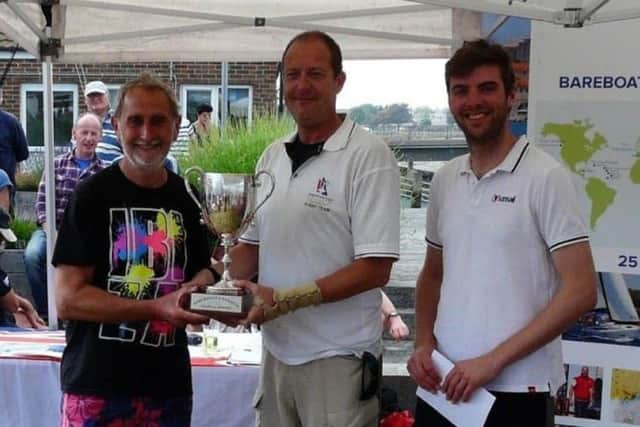 Jon Modral-Gibbons, left, celebrates his Portsmouth Regatta success