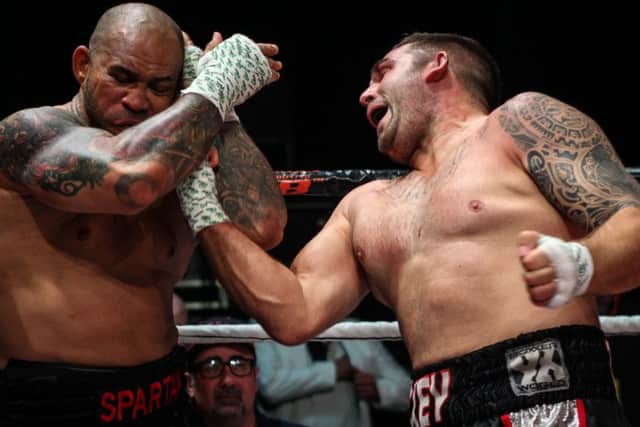 Mickey Parker, right, gets through with an uppercut against Nathan JDogg at the Indigo at the O2 in BKB11. Picture: Marc Moggridge/BKB