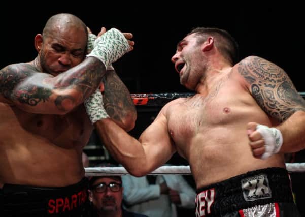 Mickey Parker, right, gets through with an uppercut against Nathan JDogg at the Indigo at the O2 in BKB11. Picture: Marc Moggridge/BKB
