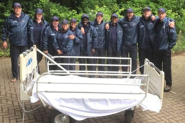 A 16-strong theatre team from QA Hospital are pushing a hospital bed 100 miles through the South Downs National Park to raise money for Dreams Come True. Picture: QA Hospital