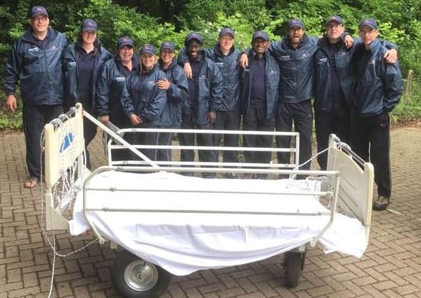 A 16-strong theatre team from QA Hospital are pushing a hospital bed 100 miles through the South Downs National Park to raise money for Dreams Come True. Picture: QA Hospital
