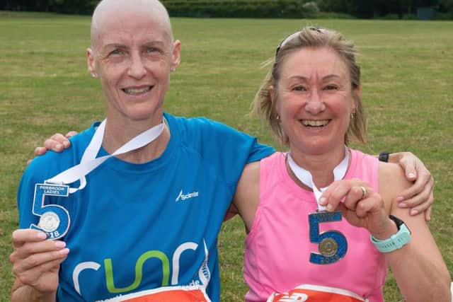 Sandra Tullett, left, and Angela Agate after finishing the Purbrook Ladies 5. Picture: Keith Woodland (180308-137)