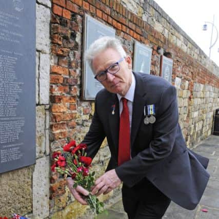 Nigel Turner, 64, from Portsmouth laid flowers at the memorial to remember those colleagues lost in The Falklands conflict - Nigel was serving on HMS Hermes as she sailed south
Picture: Malcolm Wells (180614-3831)