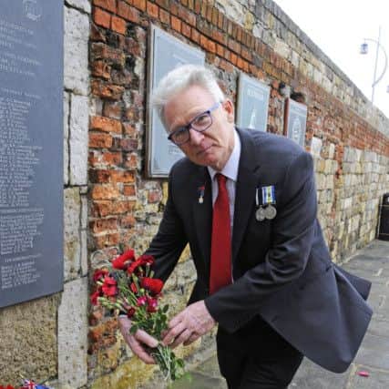 Nigel Turner, 64, from Portsmouth laid flowers at the memorial to remember those colleagues lost in The Falklands conflict - Nigel was serving on HMS Hermes as she sailed south 

Picture: Malcolm Wells (180614-3831)
