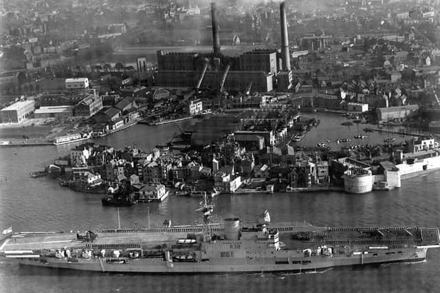 HMS Victorious leaves Portsmouth Harbour some time after 1958 as she has the angled flight deck that was fitted between 1950 and 1958.