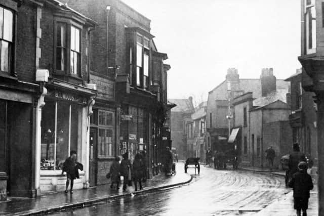 THEN: Somers Road, Portsmouth on a wet day in 1932. Does this picture evoke memories of the smell of wet pavements,  an aroma that has all but disappeared?