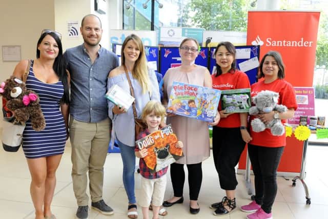 Front, Xav Tavender, five,, from Warsash was one of the first prize winners. From left,  Melissa Smith from Southsea with her brother Tim Tavender, his wife Ursula Tavender, Christine Cotton, Korneliya Tomova and Molly Jahans Picture: Malcolm Wells (180615-4046)