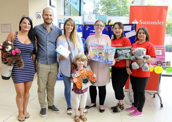 Front, Xav Tavender, five,, from Warsash was one of the first prize winners. From left,  Melissa Smith from Southsea with her brother Tim Tavender, his wife Ursula Tavender, Christine Cotton, Korneliya Tomova and Molly Jahans 

Picture: Malcolm Wells (180615-4046)