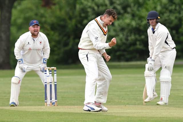 Archie Reynolds celebrates a wicket with James Scutt, left. Picture: Neil Marshall (180616_020)