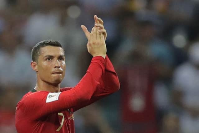 Portugal's Cristiano Ronaldo applauds after the group B match between Portugal and Spain at the 2018 soccer World Cup in the Fisht Stadium in Sochi, Russia, Friday, June 15, 2018. (AP Photo/Sergei Grits) PPP-180615-213015001