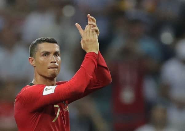 Portugal's Cristiano Ronaldo applauds after the group B match between Portugal and Spain at the 2018 soccer World Cup in the Fisht Stadium in Sochi, Russia, Friday, June 15, 2018. (AP Photo/Sergei Grits) PPP-180615-213015001