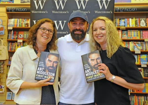 Ant Middleton with, left, Claire Middleton from Lee-on-the Solent and her friend Rae Gamblin from Gosport at Waterstones in Portsmouth this month Picture: Malcolm Wells (180607-2835)
