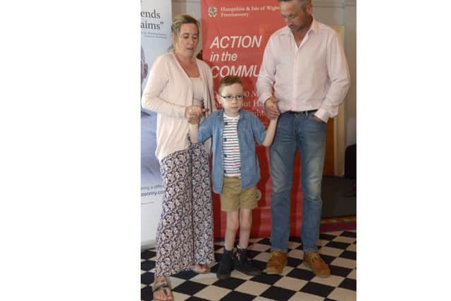 Aiden Farrell with his dad Gevun and mum Sara at the Freemasons cheque presentation night