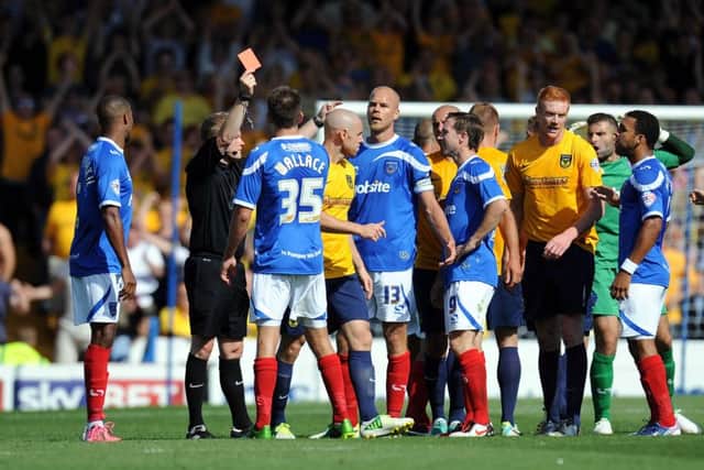 Portsmouth's Johnny Ertl (number 13) is shown the red card by the referee during the Sky Bet League Two match at Fratton Park, Portsmouth. ENGPPP00220130508113351