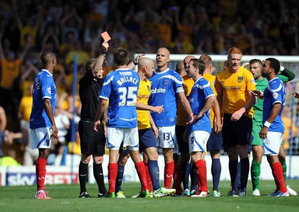 Portsmouth's Johnny Ertl (number 13) is shown the red card by the referee during the Sky Bet League Two match at Fratton Park, Portsmouth. ENGPPP00220130508113351