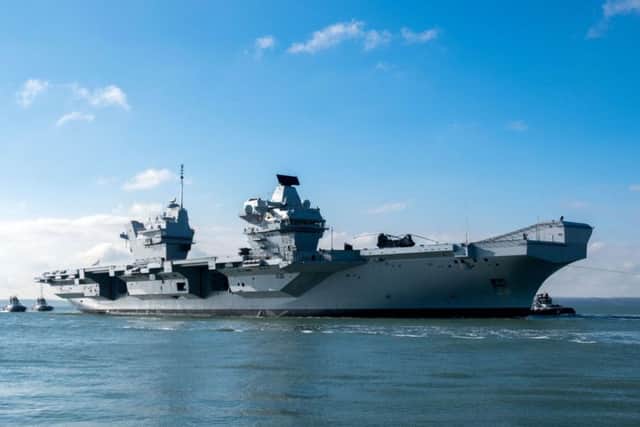 The HMS Queen Elizabeth returns to Portsmouth Harbour after sea trials. PRESS ASSOCIATION Photo. Picture date: Tuesday February 27, 2018. Photo credit should read: Steve Parsons/PA Wire PPP-180227-135035001