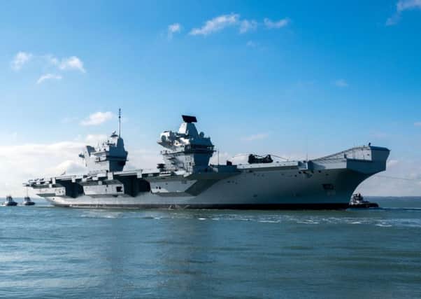 The HMS Queen Elizabeth returns to Portsmouth Harbour after sea trials. PRESS ASSOCIATION Photo. Picture date: Tuesday February 27, 2018. Photo credit should read: Steve Parsons/PA Wire PPP-180227-135035001