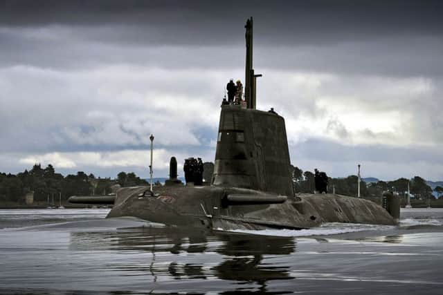 HMS AMBUSH returning to HMNB Clyde on the Clyde estuary under moody summer skys Scotland.Ambush, second of the nuclear powered attack submarines. PHOTO:  MoD