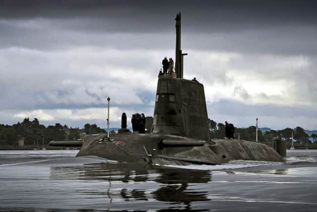 HMS AMBUSH returning to HMNB Clyde on the Clyde estuary under moody summer skys Scotland.

Ambush, second of the nuclear powered attack submarines. PHOTO:  MoD