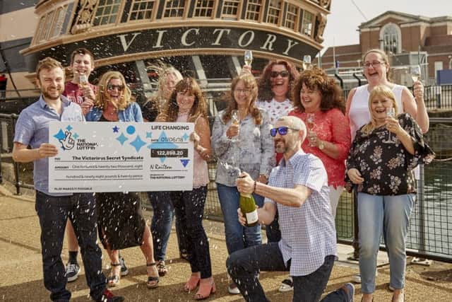 The Victorious Secret syndicate, celebrating the win at HMS Victory, Portsmouth Historic Dockyard