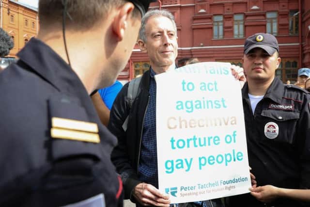 Gay rights campaigner Peter Tatchell is questioned and led away by Russian authorities in Moscow after staging a one-man protest near Red Square. Picture by Aaron Chown/PA Wire