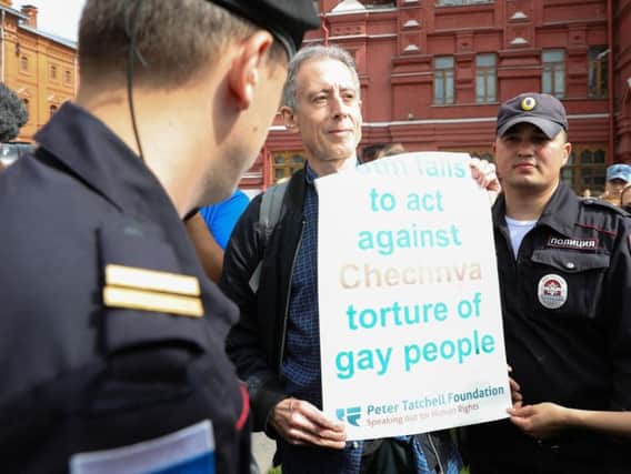 Gay rights campaigner Peter Tatchell is questioned and led away by Russian authorities in Moscow after staging a one-man protest near Red Square. Picture by Aaron Chown/PA Wire