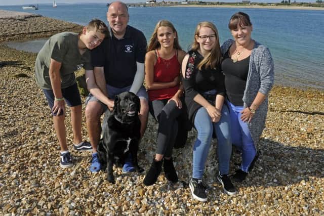 The families, and Dave, reunited on the Hayling Island beach near to where the incident happened. Picture Ian Hargreaves  (171089-1) PPP-170109-140421006