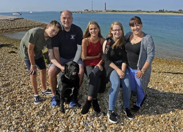 The families, and Dave, reunited on the Hayling Island beach near to where the incident happened. Picture Ian Hargreaves  (171089-1) PPP-170109-140421006