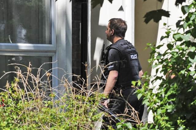 Police officers were seen entering a property in Outram Road, Southsea, on June 18