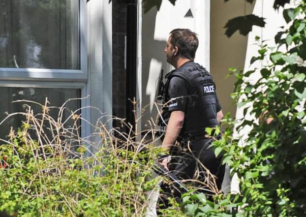 Police officers were seen entering a property in Outram Road, Southsea, on June 18