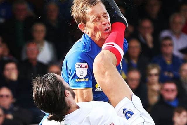Paul Robinson was inadvertently kicked in the face by Christian Burgess when Pompey played AFC Wimbledon last seasonn. Picture: Joe Pepler