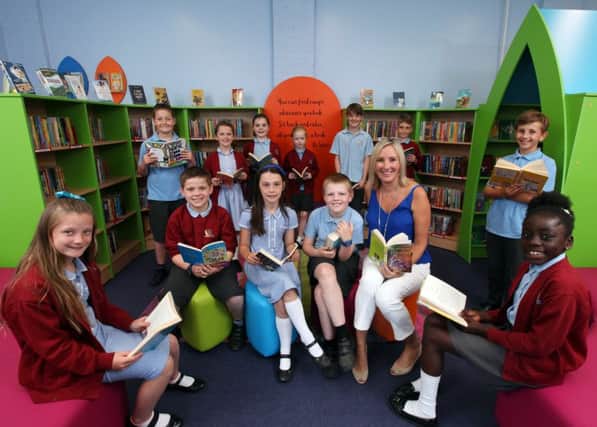 The School Council and Caroline Dinenage MP at the opening of the new library at Crofton Anne Dale Junior School, Stubbington. Picture: Chris Moorhouse