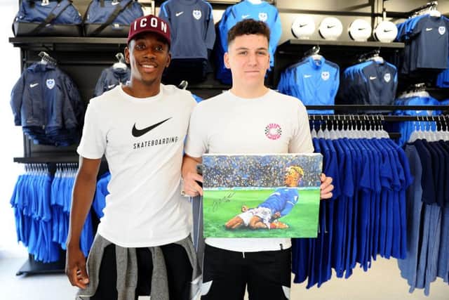 Pompey player Jamal Lowe with Sam Parrott, from Fareham, who celebrated his 18th birthday on the day of the new shop opening
Picture: Sarah Standing (180528-7595)