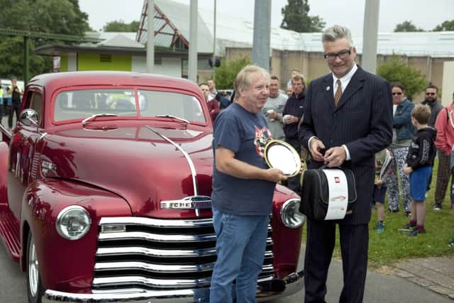 Hot Rod and Custom Best in Show winner Clive Hardy is presented with trophy by Andy Saunders