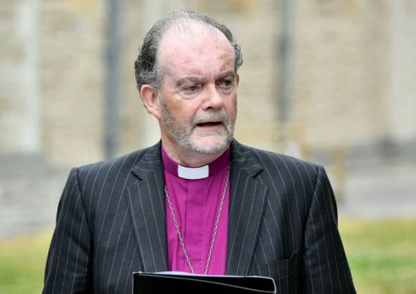 Bishop James Jones delivers a statement on behalf of the panel outside Portsmouth Cathedral. Picture: Dominic Lipinski/PA Wire
