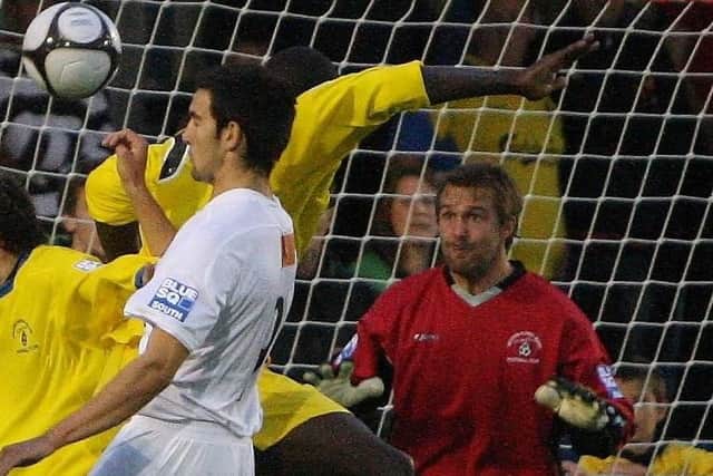 Ryan Northmore, in goal against the Hawks during his playing days, has been forced to step down as Gosport Borough boss.