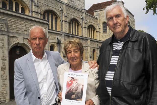 Eric Cousins with Pauline Godley, son and daughter of Arthur Cousins, and Norman Godley outside Portsmouth Cathedral in Old Portsmouth.
Picture: Malcolm Wells (180620-5209)