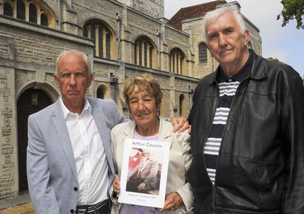 Eric Cousins with Pauline Godley, son and daughter of Arthur Cousins, and Norman Godley outside Portsmouth Cathedral in Old Portsmouth. 

Picture: Malcolm Wells (180620-5209)