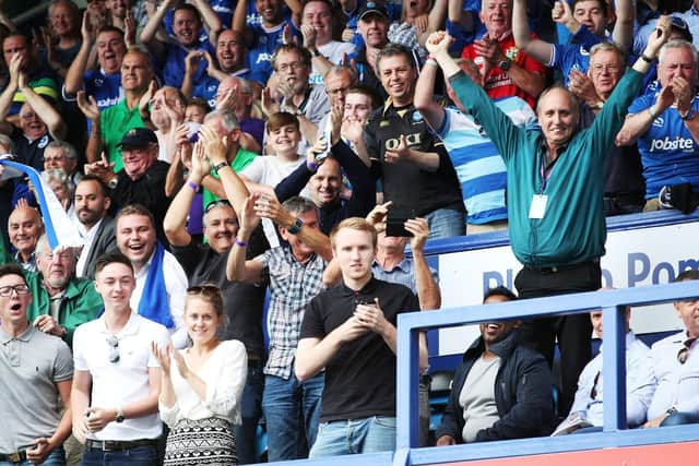 Pompey fans celebrate Pompey's 2-0 success over Rochdale on the opening day of last season.