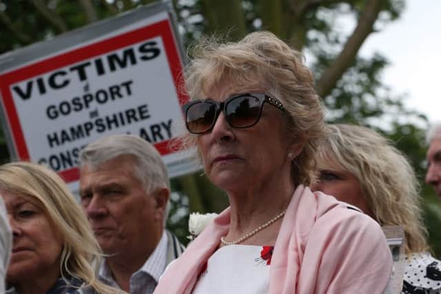 Ann Reeves, centre, surrounded by families at the release of Gosport Independent Panel's report into deaths at Gosport War Memorial Hospital yesterday. Picture: Chris Moorhouse
