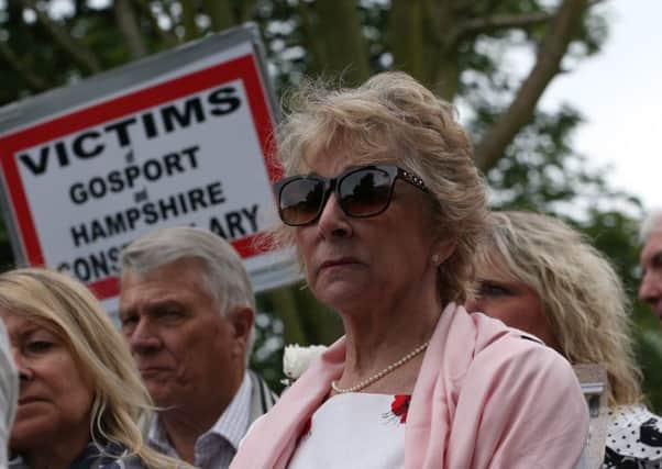 Ann Reeves, centre, surrounded by families at the release of Gosport Independent Panel's report into deaths at Gosport War Memorial Hospital yesterday. Picture: Chris Moorhouse