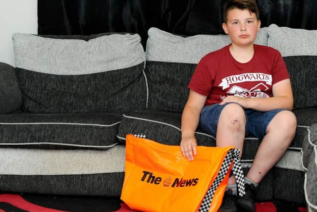 Samuel Heslop, 13, from Havant, has been left bruised, grazed and shaken and forced to complete his paper round on foot after he was knocked off his bike by a van in Bedhampton Way
Picture: Sarah Standing (180532-716)