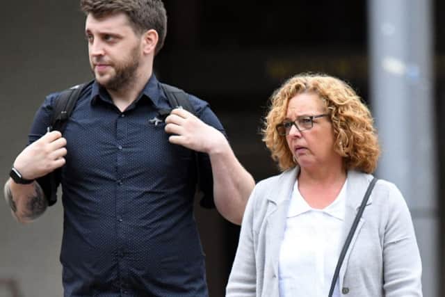 Emma Hayden, partner of deceased Peter Maher, with son Ben Maher outside Portsmouth Coroner's Court