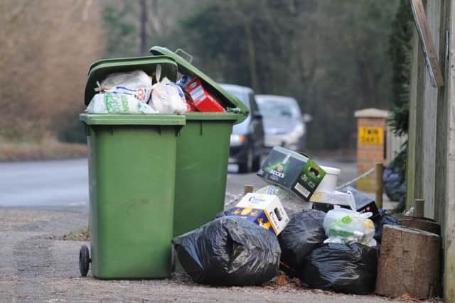 Wheelie bins overflowing with rubbish